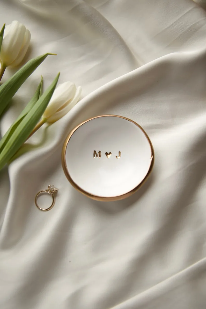 Personalized wedding ring dish on ivory fabric
